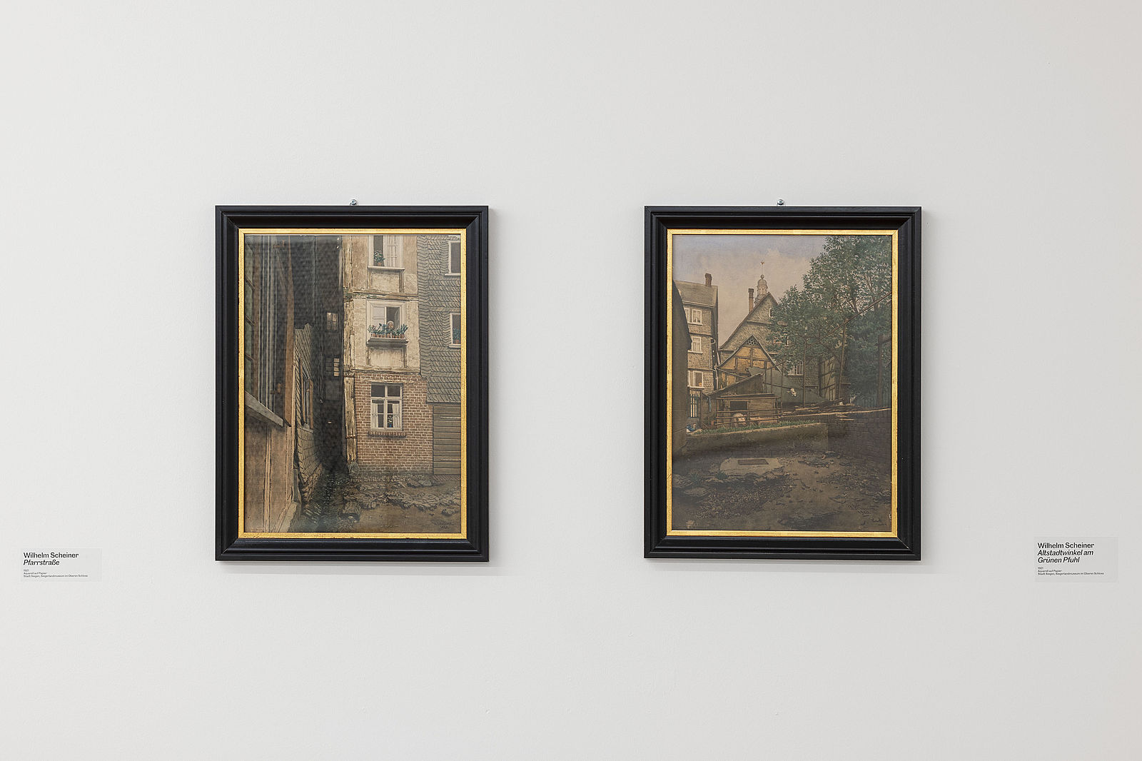 <p>Exhibition view, Shortcuts, works by Wilhelm Scheiner, Siegen: Alt-Siegen, Pfarrstrasse, 1921, Hof in der Hinterstrasse, 1921, Collection Siegerlandmuseum, Oberes Schloss, Siegen, photo: Philipp Ottendörfer</p>