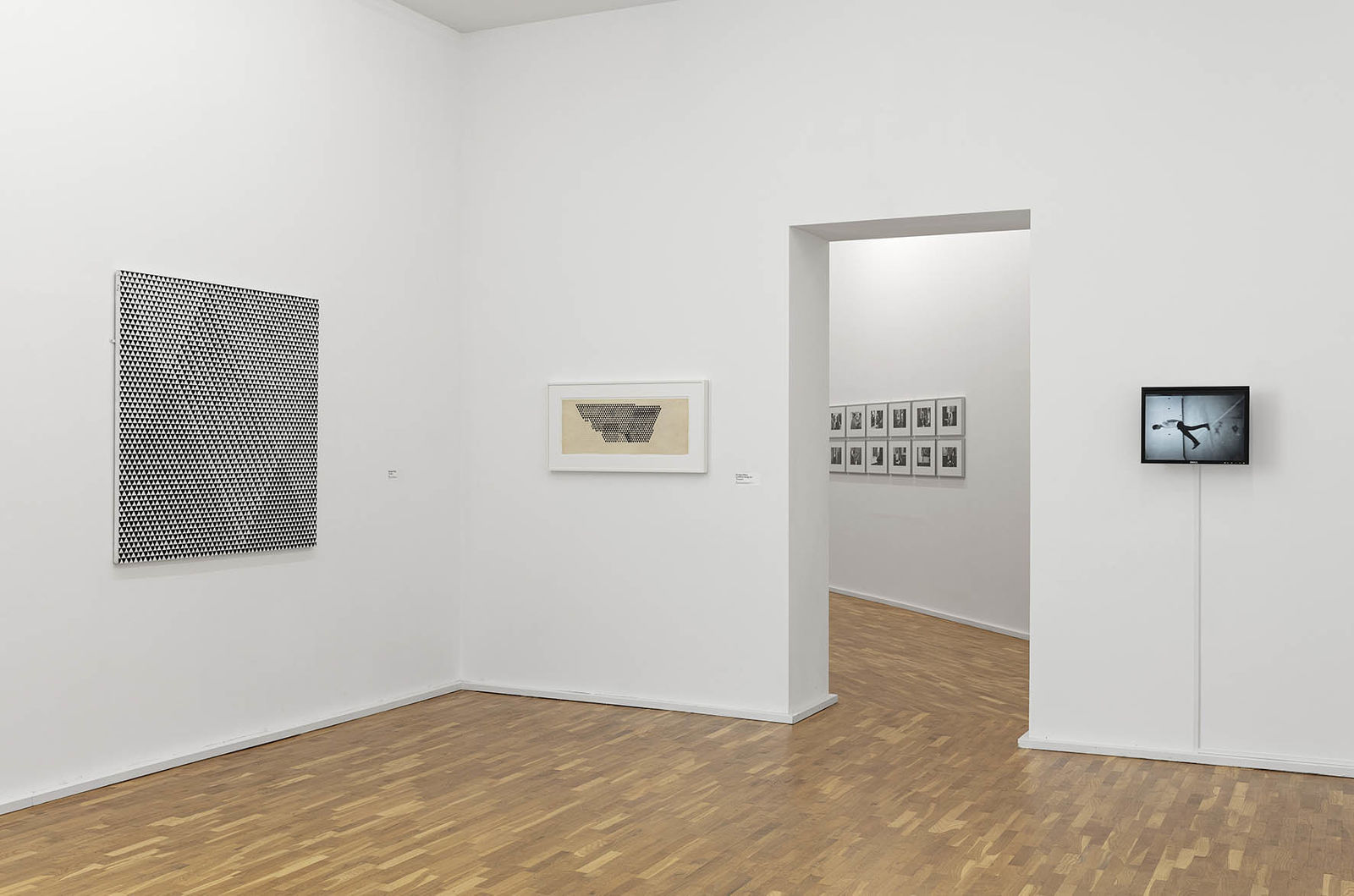 <p>Our Present, Exhibition view, MGKSiegen, Works by Bridget Riley, Tremor, 1962, Untitled (Study for Tremor), 1961, Courtesy the artist, Work by Bruce Nauman, Slow Angle Walk, 1968, © VG Bild-Kunst, Bonn 2020, Photo: Philipp Ottendörfer</p>